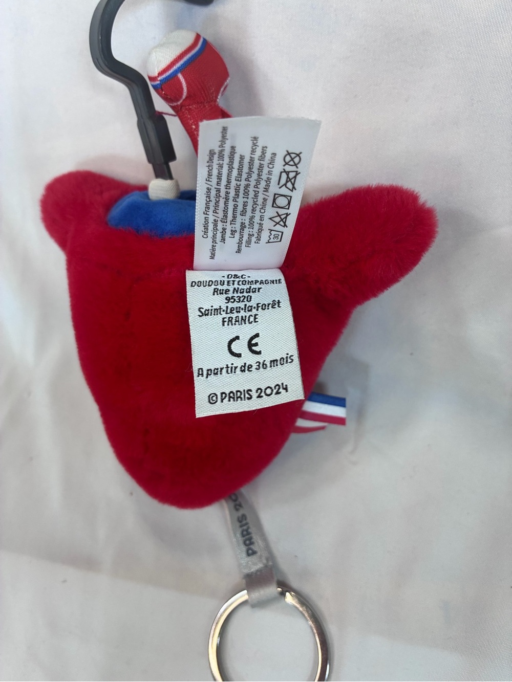 Red Paris 2024 Official Mascot Plush Keychain - Paralympics Prosthetic Leg - Picture 3 of 3